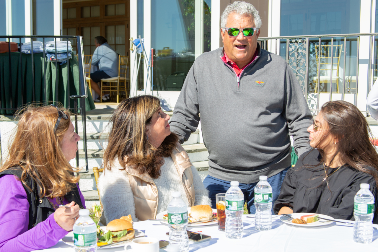 Former Yankees catcher Rick Cerone chats with Board Member Liz Giordano and friends